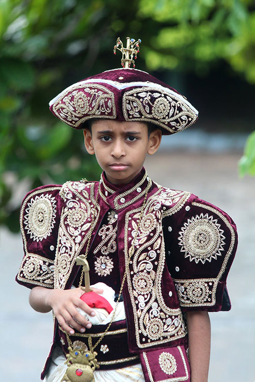 Sri Lankan boy wearing festive traditional attire